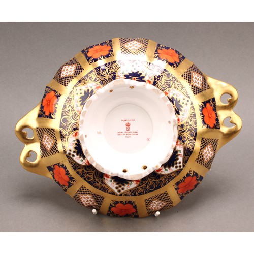 192 - A Royal Crown Derby 1128 Imari pattern Duchess pedestal dish, solid gold band, leafy scroll handles,... 