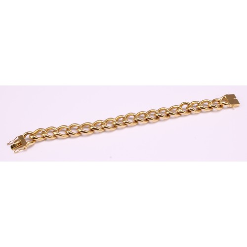 1245 - An 18ct gold curb link bracelet, 12mm wide, 19cm long, double safety clip sides, stamped 18, CMR, Bi... 