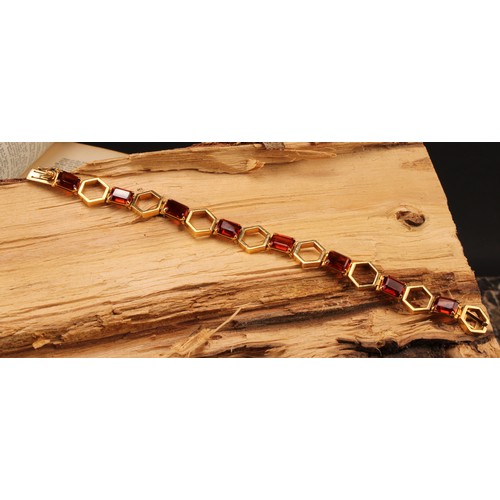 1167 - 18ct gold Citrine geometric design bracelet 
The bracelet has eight emerald cut sherry coloured Citr... 