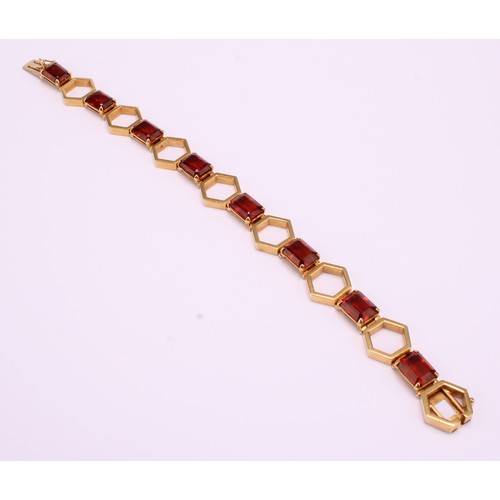 1167 - 18ct gold Citrine geometric design bracelet 
The bracelet has eight emerald cut sherry coloured Citr... 