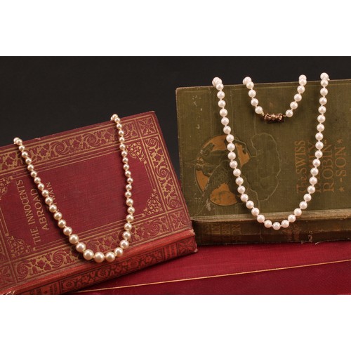 1268 - Two sets of Pearls; to include; a white approx. 5mm cultured pearl necklace with a bow design 9ct go... 