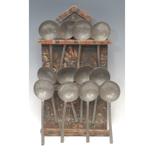 2204 - A harlequin set of twelve pewter slip top spoons, typically 18.5cm long, eleven with touch mark RA, ... 