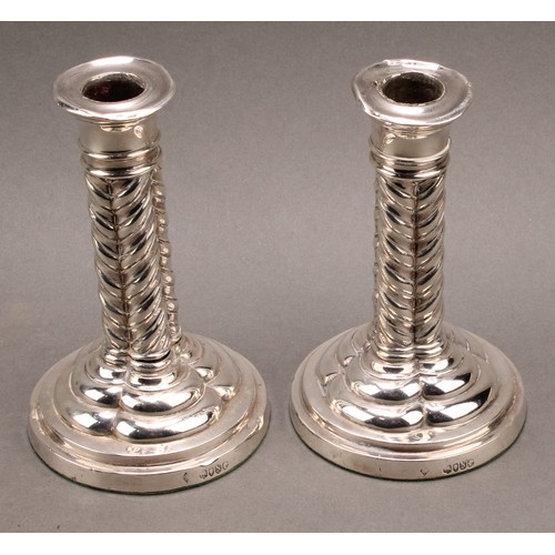 891 - A pair of Victorian Gothic Revival silver cluster column candlesticks, circular bases, loaded, 14.5c... 