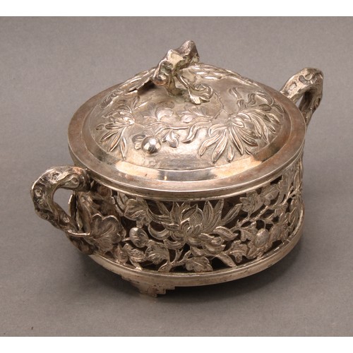 722 - A Chinese silver coloured metal dish and cover, pierced and chased with flowers and scrolling leaves... 