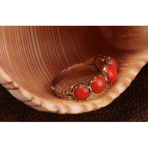 1234 - A Tested 9ct gold Coral ring,
set with five graduated round cabochon corals that measure between app... 