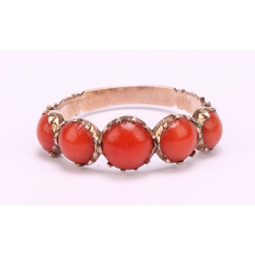 1234 - A Tested 9ct gold Coral ring,
set with five graduated round cabochon corals that measure between app... 