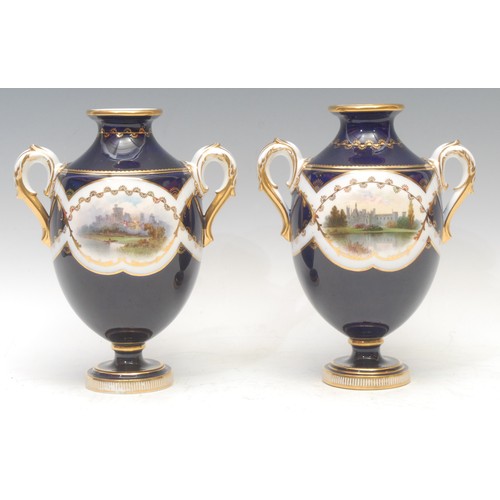 102 - A pair of Mintons named view two-handled ovoid pedestal vases, painted with Windsor Castle and Alton... 