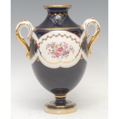 102 - A pair of Mintons named view two-handled ovoid pedestal vases, painted with Windsor Castle and Alton... 