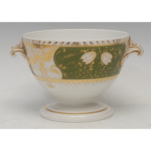 107 - A Royal Worcester bowl, in Japanesque style, painted with pink roses on gilt branches, yellow ground... 