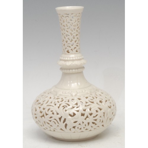 125 - A Graingers Worcester reticulated bottle vase, in the white, 18cm high, impressed mark; a Graingers ... 