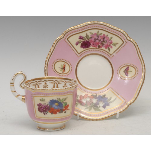 47 - A Chamberlains Worcester cup and saucer, painted with flowers within shaped gilt reserves, highlight... 