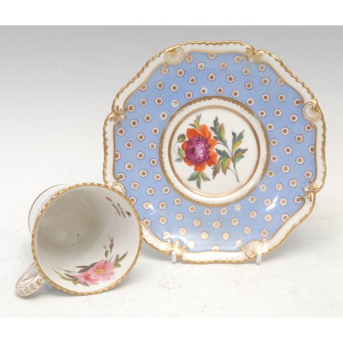 47 - A Chamberlains Worcester cup and saucer, painted with flowers within shaped gilt reserves, highlight... 