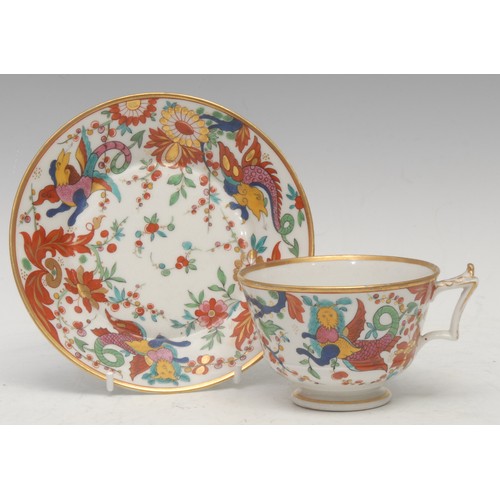 41 - A Barr Flight and Barr teacup and saucer, painted in polychrome with fanciful beasts amongst stylise... 