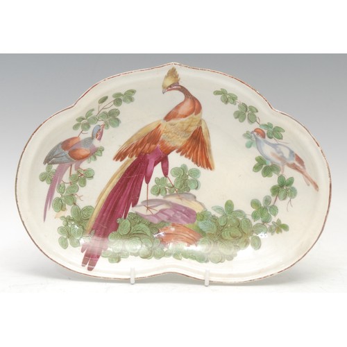 56 - A Chelsea porcelain heart shaped dish, boldly painted with an exotic bird perched on a rocky outcrop... 