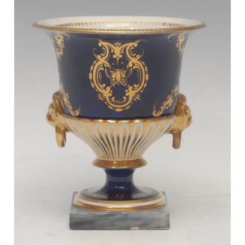 51 - A Chamberlains Worcester half-fluted campana shaped vase, painted with fanciful bird, within a gilt ... 