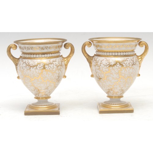 98 - A pair of Flight Barr and Barr two-handled ovoid pedestal vases, painted with exotic bird, on a gilt... 