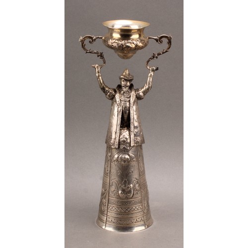 833 - A German silver figural wager cup, in the Renaissance taste, with a bearded man, bust length and wea... 