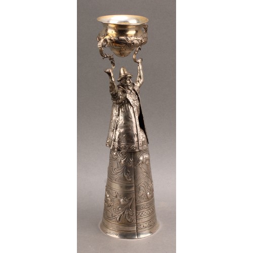 833 - A German silver figural wager cup, in the Renaissance taste, with a bearded man, bust length and wea... 