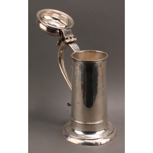 842 - A large George I silver bun lid flagon, hinged cover with scroll thumb-piece, S-scroll handle, three... 