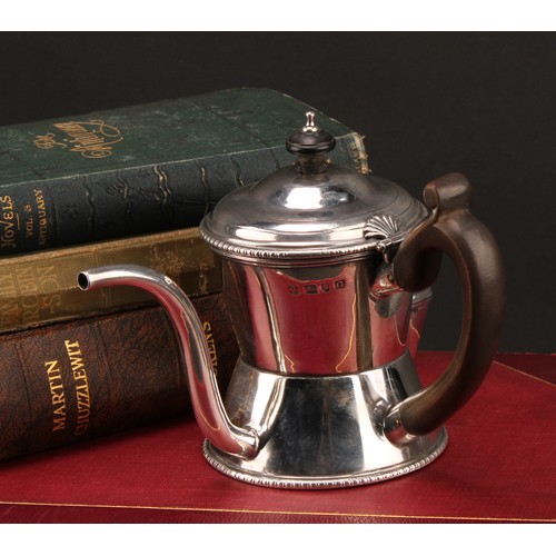 1017 - An early George III silver argyle, domed cover with shell shaped hinge, scroll-capped fruitwood hand... 