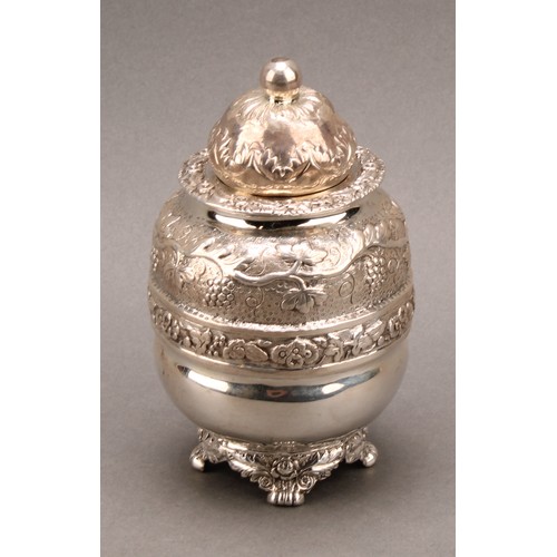 801 - A George IV silver ovoid tea caddy, chased with bands of fruiting vine, domed cover, paw feet, 13cm ... 