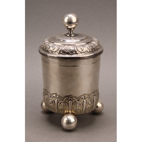 981 - An 18th century German silver cup and cover, chased with bands of leaves and ovolo strapwork, ball f... 