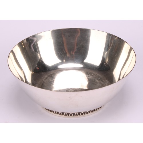 1103 - Georg Jensen - a pair of Danish silver circular bowls, designed by Sigvard Bernadotte, cast feet wit... 