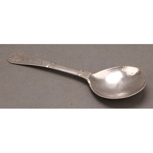 668 - An 18th century Scandinavian silver spoon, possibly Norwegian, the stem engraved with a flowering st... 