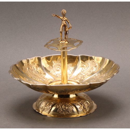 732 - A Continental silver fluted oval pedestal sweetmeat dish, the centre with figural finial above provi... 