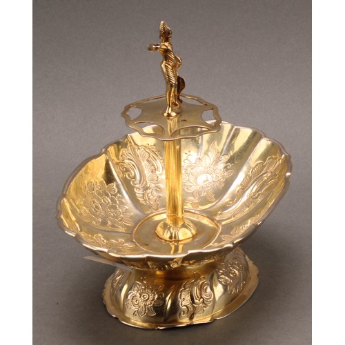 732 - A Continental silver fluted oval pedestal sweetmeat dish, the centre with figural finial above provi... 