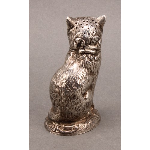 1013 - An early 20th century silver novelty pepper, as a cat, seated, 7.5cm high, import mark for Chester 1... 