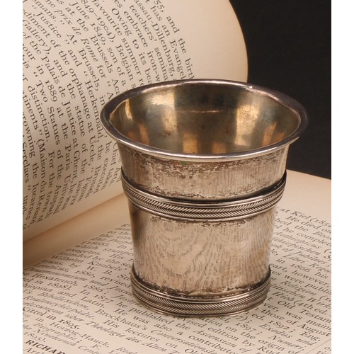 975 - An 18th century Continental silver beaker or tot, probably Scandinavian, rope-twist girdles, 5cm hig... 