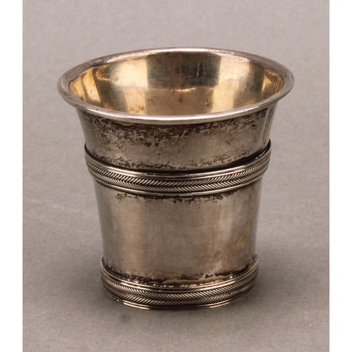 975 - An 18th century Continental silver beaker or tot, probably Scandinavian, rope-twist girdles, 5cm hig... 