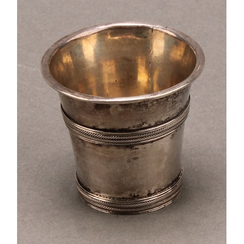 975 - An 18th century Continental silver beaker or tot, probably Scandinavian, rope-twist girdles, 5cm hig... 
