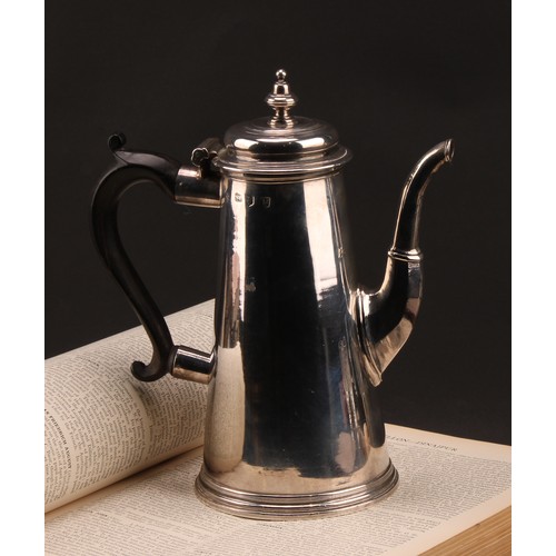 754 - A George I silver conical coffee pot, hinged domed cover with knop finial, scroll-capped fruitwood h... 