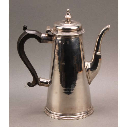 754 - A George I silver conical coffee pot, hinged domed cover with knop finial, scroll-capped fruitwood h... 