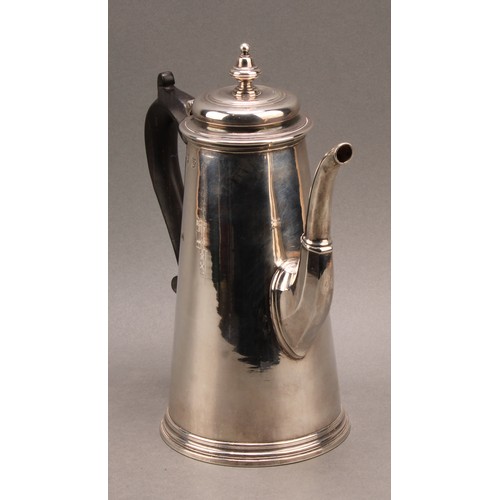 754 - A George I silver conical coffee pot, hinged domed cover with knop finial, scroll-capped fruitwood h... 