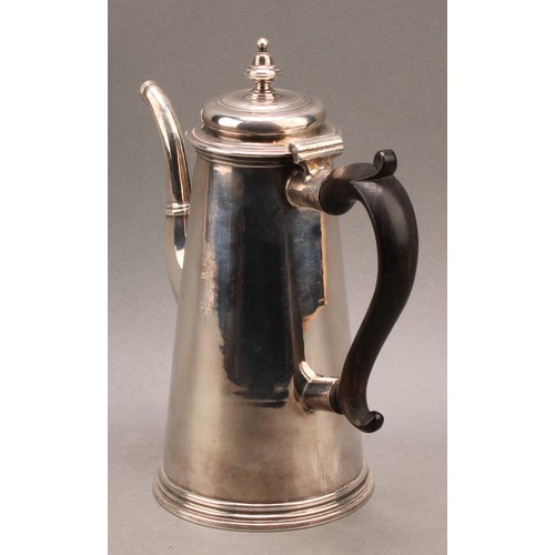 754 - A George I silver conical coffee pot, hinged domed cover with knop finial, scroll-capped fruitwood h... 