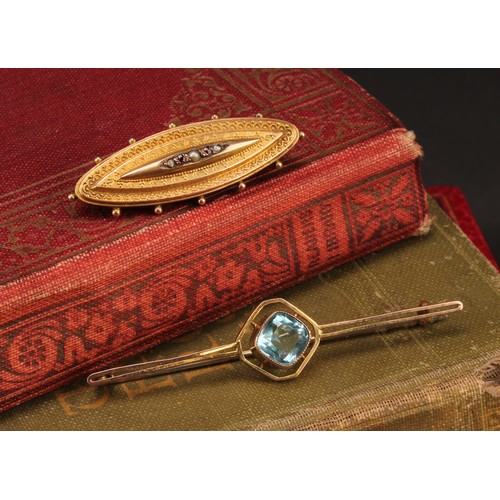 1265 - Two 9ct gold brooches to include; a 9ct gold Etruscan Revival garnet and seed pearl mourning brooch ... 