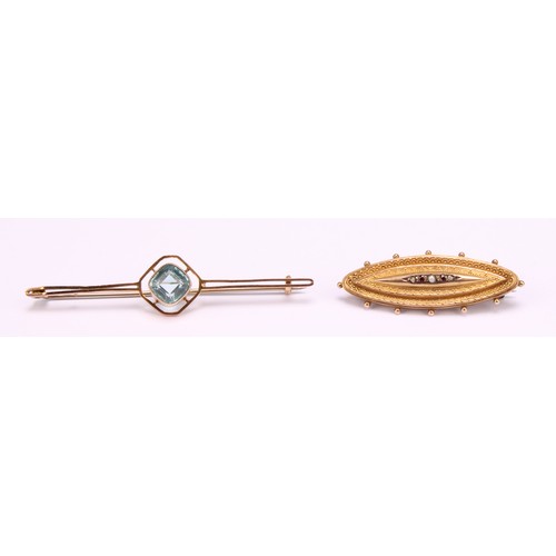 1265 - Two 9ct gold brooches to include; a 9ct gold Etruscan Revival garnet and seed pearl mourning brooch ... 