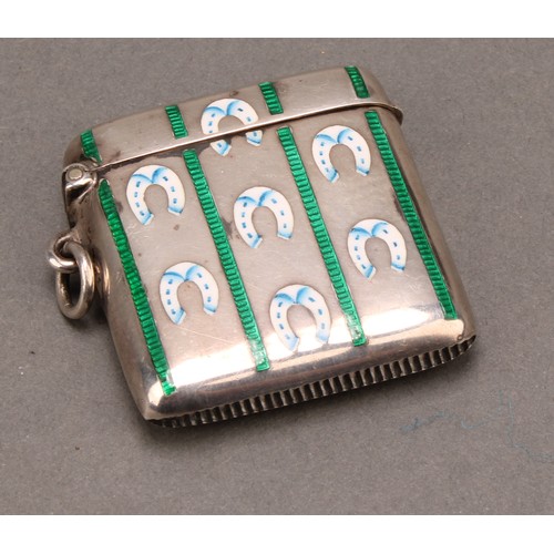 1027 - An Edwardian silver and enamel rounded rectangular vesta case, decorated in polychrome with horse sh... 