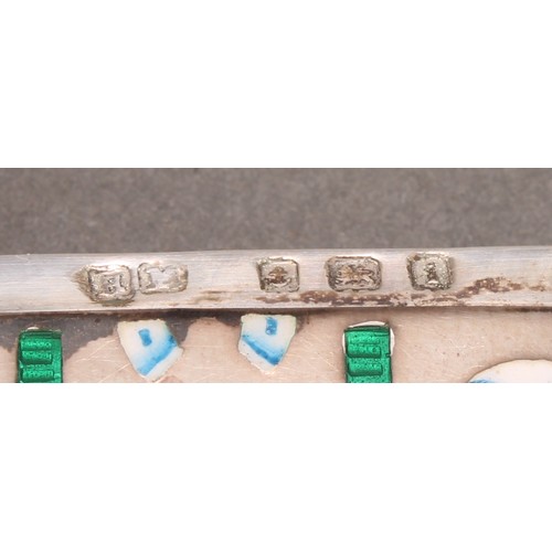 1027 - An Edwardian silver and enamel rounded rectangular vesta case, decorated in polychrome with horse sh... 