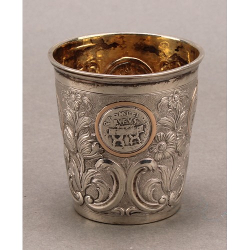 736 - A Continental silver tapered cylindrical beaker, chased with flowering leafy stems and set with Roma... 