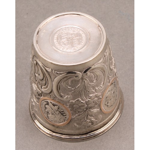 736 - A Continental silver tapered cylindrical beaker, chased with flowering leafy stems and set with Roma... 