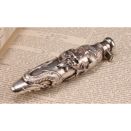 836 - A Japanese silver scent bottle, chased with a ferocious dragon on a textured ground, hinged domed co... 