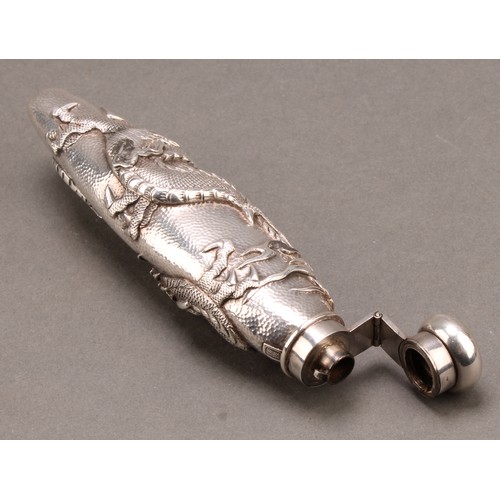 836 - A Japanese silver scent bottle, chased with a ferocious dragon on a textured ground, hinged domed co... 