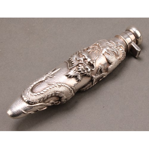 836 - A Japanese silver scent bottle, chased with a ferocious dragon on a textured ground, hinged domed co... 