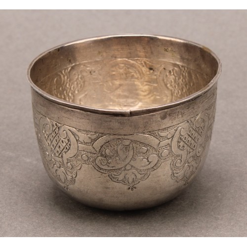 984 - An 18th century Russian silver tumbler, chased with strapwork, 5cm diam, Cyrillic mark, c.1735