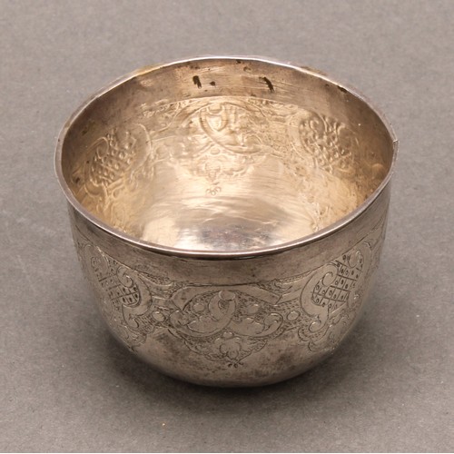 984 - An 18th century Russian silver tumbler, chased with strapwork, 5cm diam, Cyrillic mark, c.1735