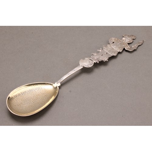 658 - A German silver spoon, the silhouette terminal as a Renaissance falconer, planished and gilt bowl, 2... 